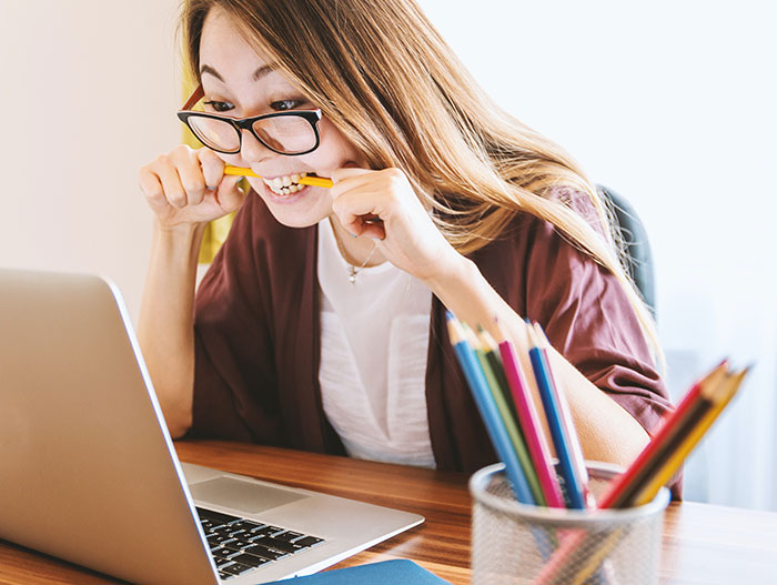 Angry woman looking at computer