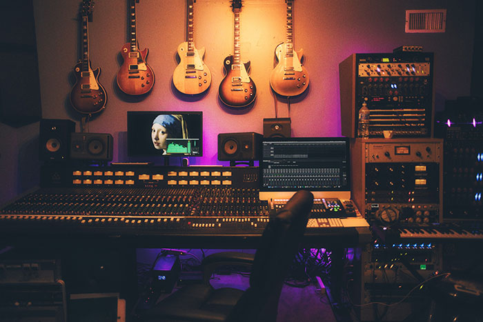 Picture of music studio with hanging guitars
