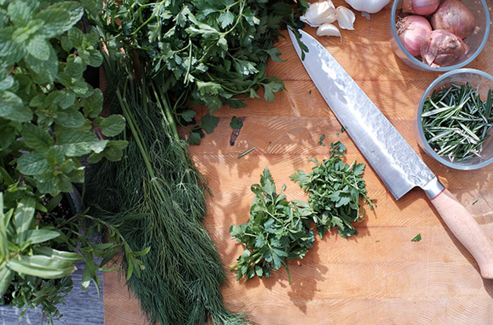 photo of herbs on wooden cutting board