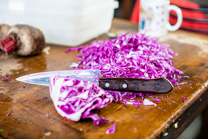 Purple cabbage on wooden table 