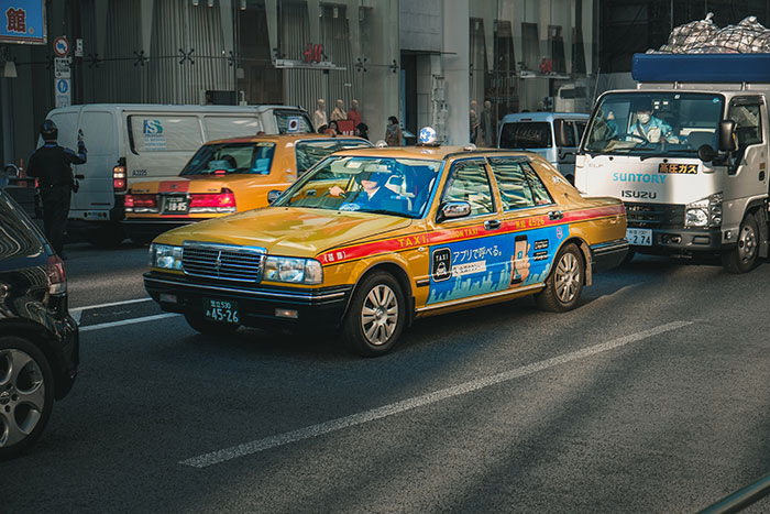 Yellow taxi car in traffic