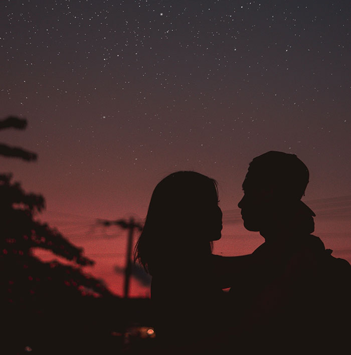 Couple silhouette at night
