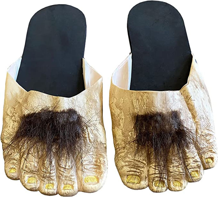 Weird shoes resembling hairy hobbit feet with detailed toes and black soles.