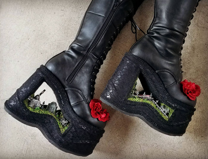 Weird shoes with black boots, red roses, and miniature graveyard scenes in platform heels.
