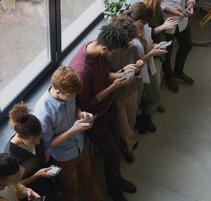 People looking at their phones