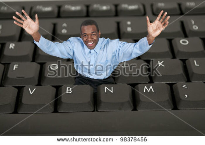 "Man Trapped Inside Keyboard But Surprisingly Happy About It"