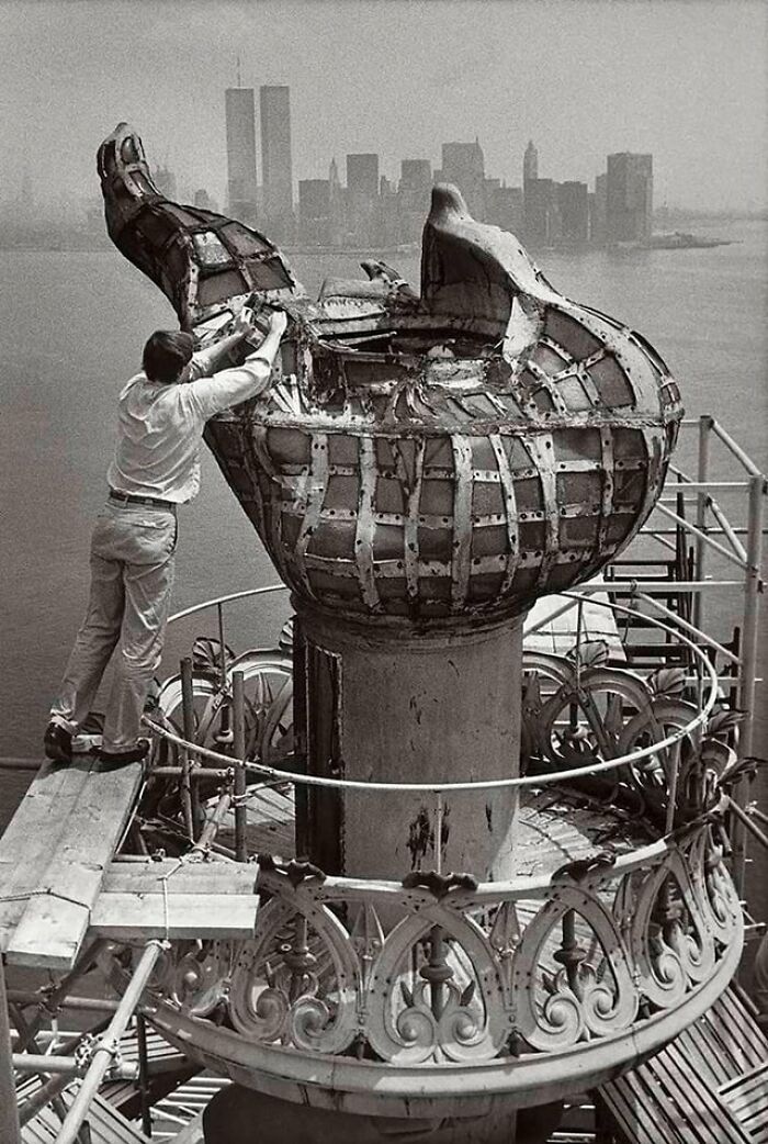 A Construction Worker Making Preparations For The Removal Of The Original Statue Of Liberty Torch In 1985