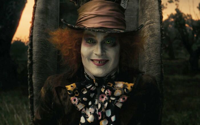 Actor in colorful costume and makeup, portraying a whimsical character, representing highest-paid actors in film history.