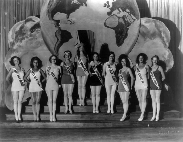 ten participants in beauty pageant standing on the scene
