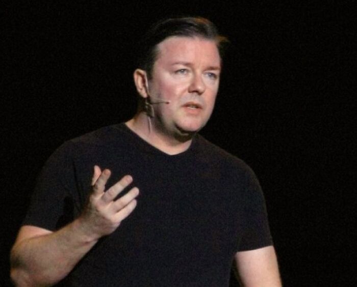 Ricky Gervais wearing black sweater 
