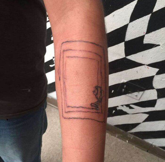 Funny tattoo of a stick figure pushing a door on an arm, creating a humorous illusion.