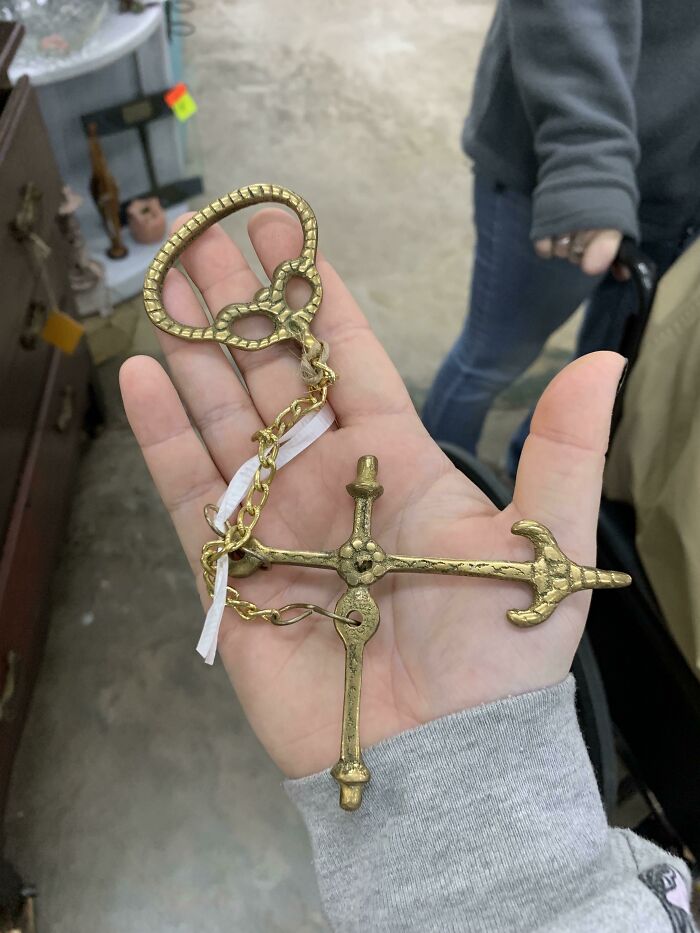 Lightweight, Metal Object With Chain Connecting Two Pieces. Both Sides Are Identical With No Identifying Marks. Labeled As “Mystery Item”