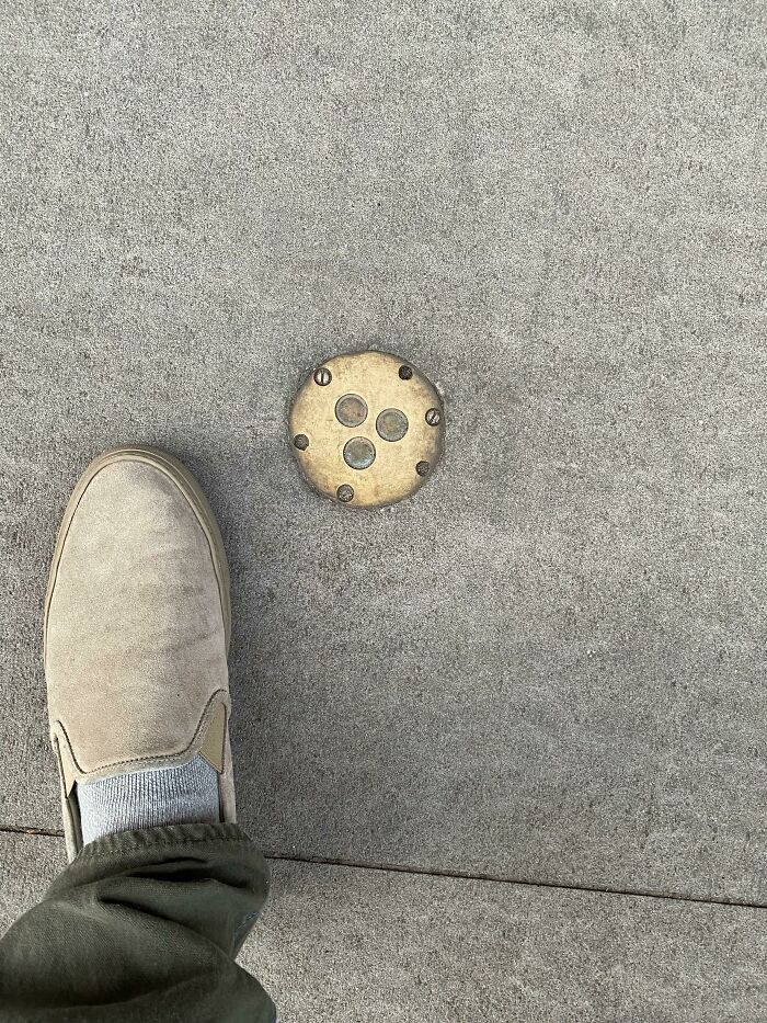 I’ve Been Walking By This On The North Side Of 10th St (Between 6th And 5th Ave In The West Village) In NYC For Years. It’s The Only One Like It That I Know Of. Made Of Brass, Embedded In The Sidewalk. What Is It?