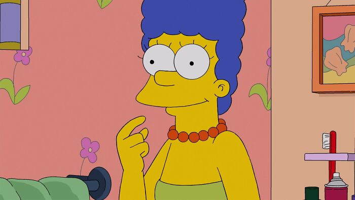 Marge Simpson with her finger up in a room