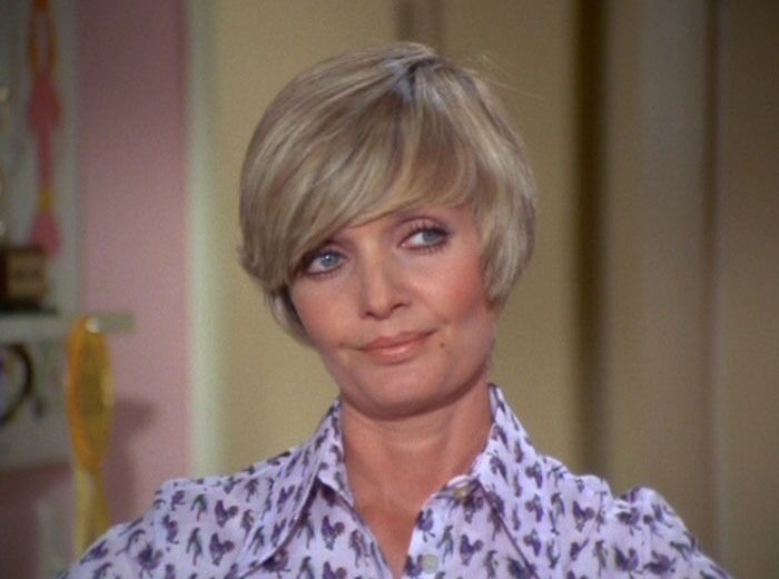 Carol Brady is looking to the left