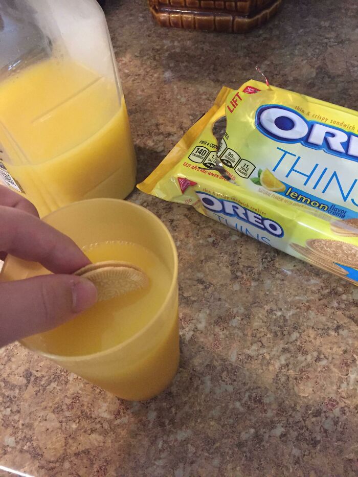 Oreo cookie dipped in orange juice