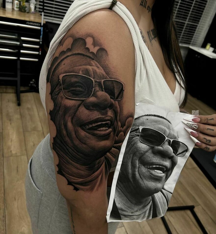 A portrait of family member tattoo on arm