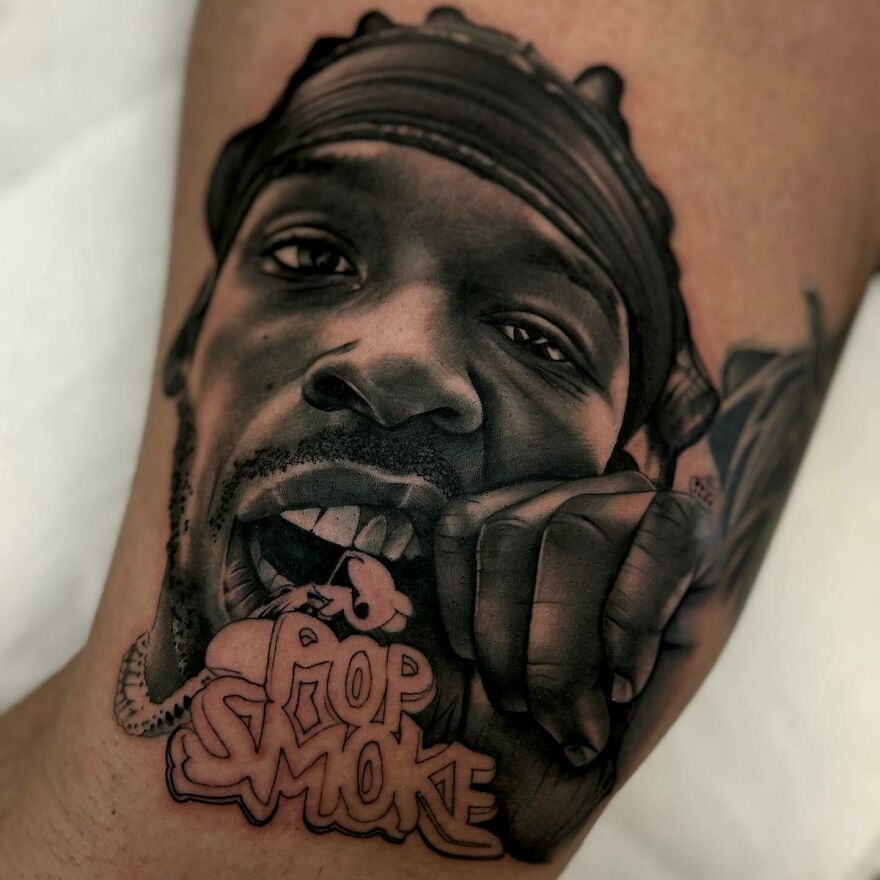Black man's face tattoo with Pop Smoke lettering tattoo