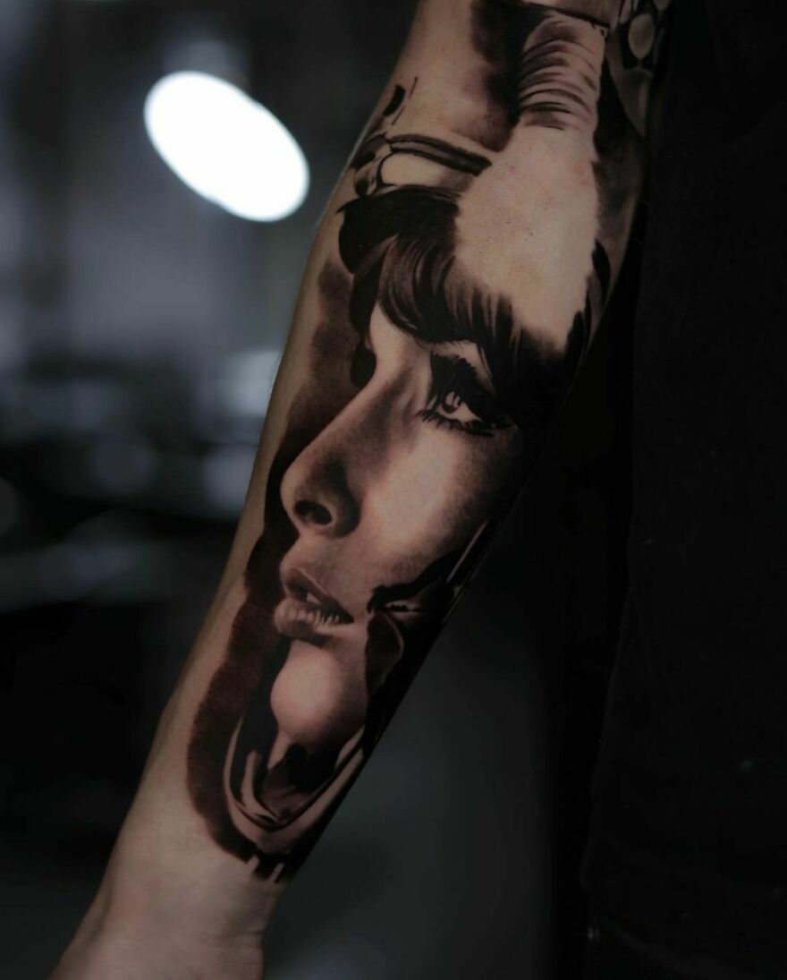 Realistic tattoo depicting a girl's profile looking up, showcasing exquisite detail and shading on forearm.