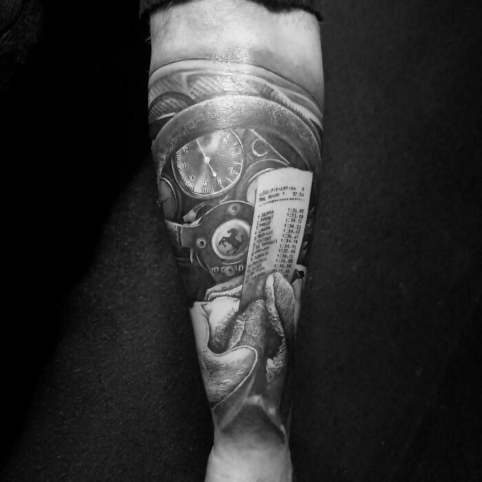 A super realistic tattoo on a forearm featuring a detailed clock and mechanical design in grayscale.