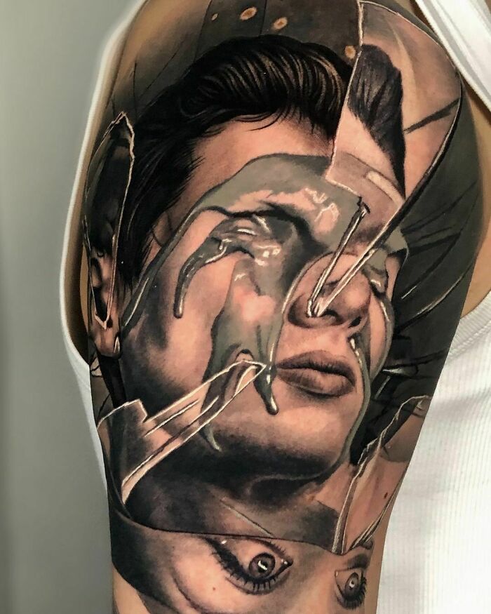 Realistic tattoo on arm depicting a fragmented face design with intricate shading and detail.