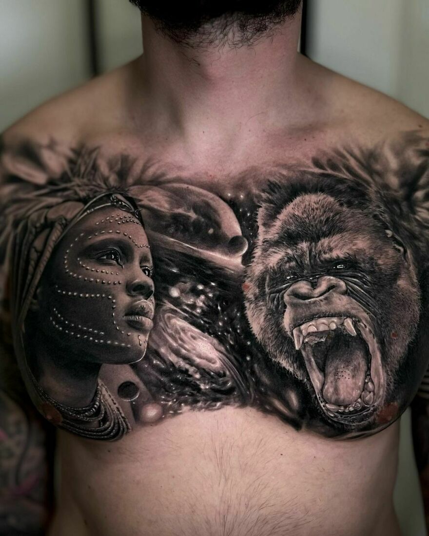 African theme chest tattoo with detailed black woman, chimpanzee, and cosmic elements.