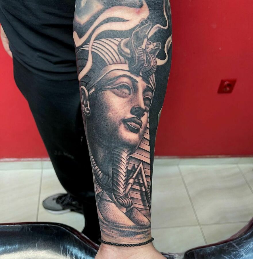 Egypt theme Sphinx head arm tattoo
