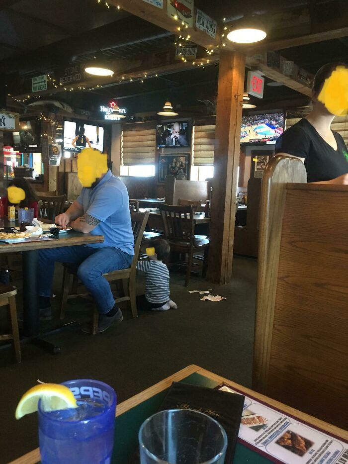 These Parents Allow Their Child To Crawl Around On The Floor Tearing Up Paper And Possibly Drawing On The Backs Of Chairs