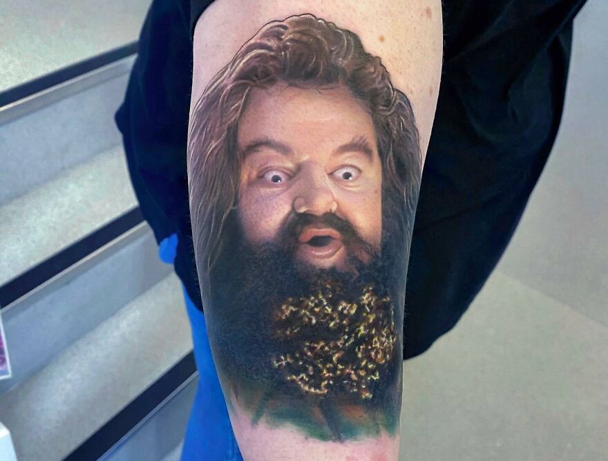 Realistic tattoo of a giant Hagrid portrait, showcasing detailed artistry.