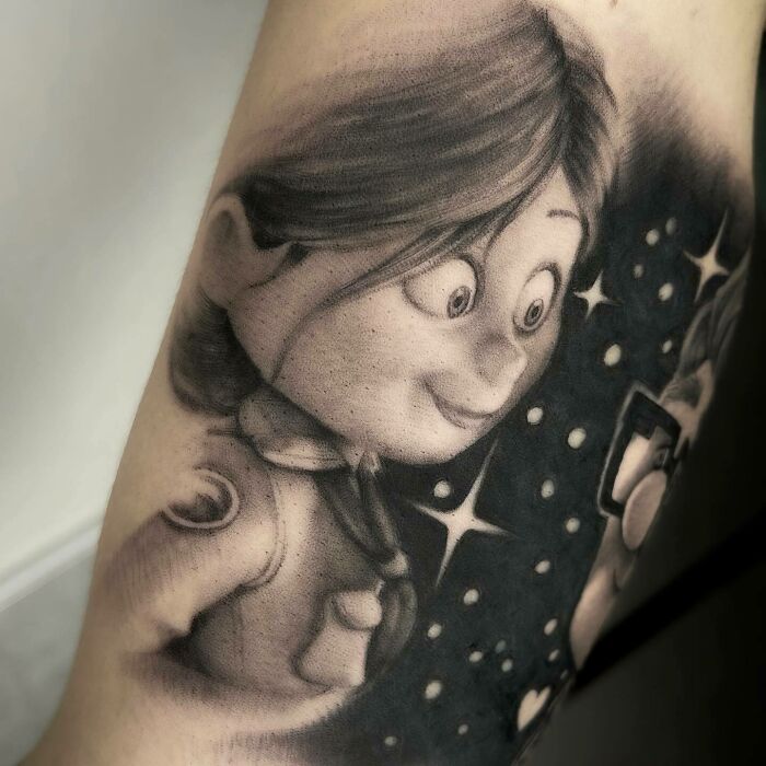 A super realistic tattoo of a cartoon character, showcasing detailed shading and expression.