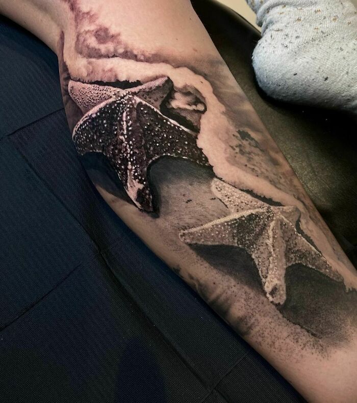 Realistic starfish tattoo design on arm, showcasing intricate details and shading.