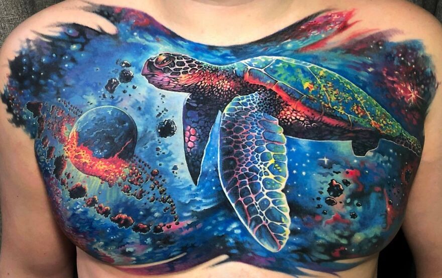Large colorful space turtle underwater tattoo on chest