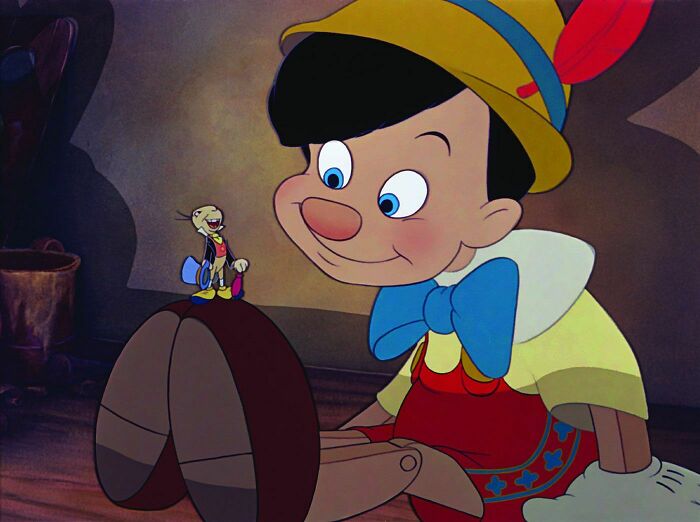 Pinocchio looking at the Cricket