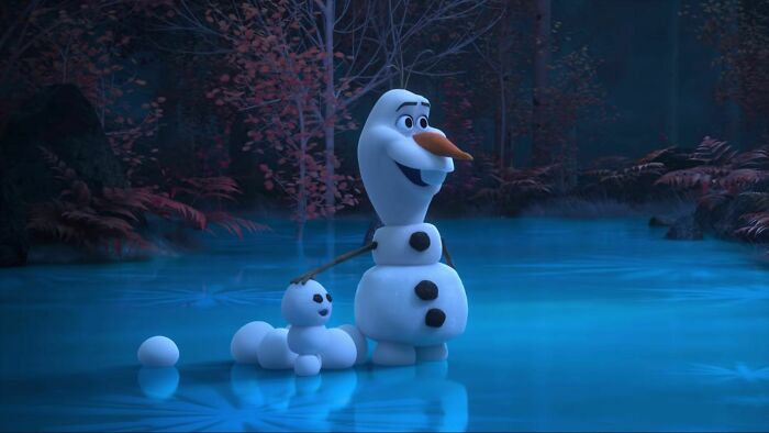 Olaf making snowman 