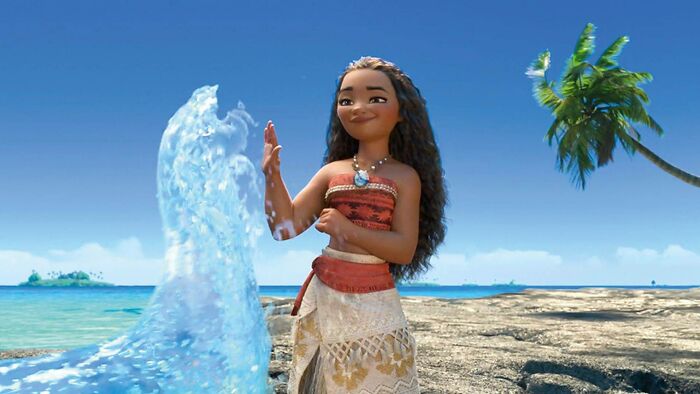 Moana giving high five to the wave