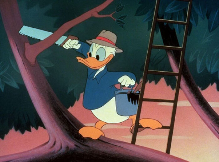 Donald Duck sawing a branch