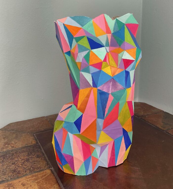 a colorful paper figure of a woman