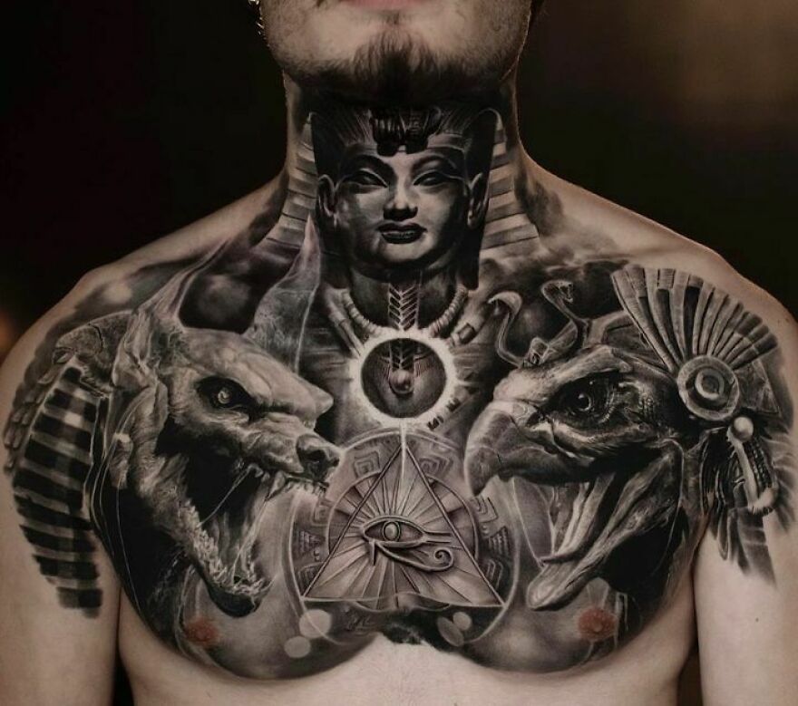 Egyptian-themed realistic chest tattoo with intricate detailing, featuring deities and symbols.