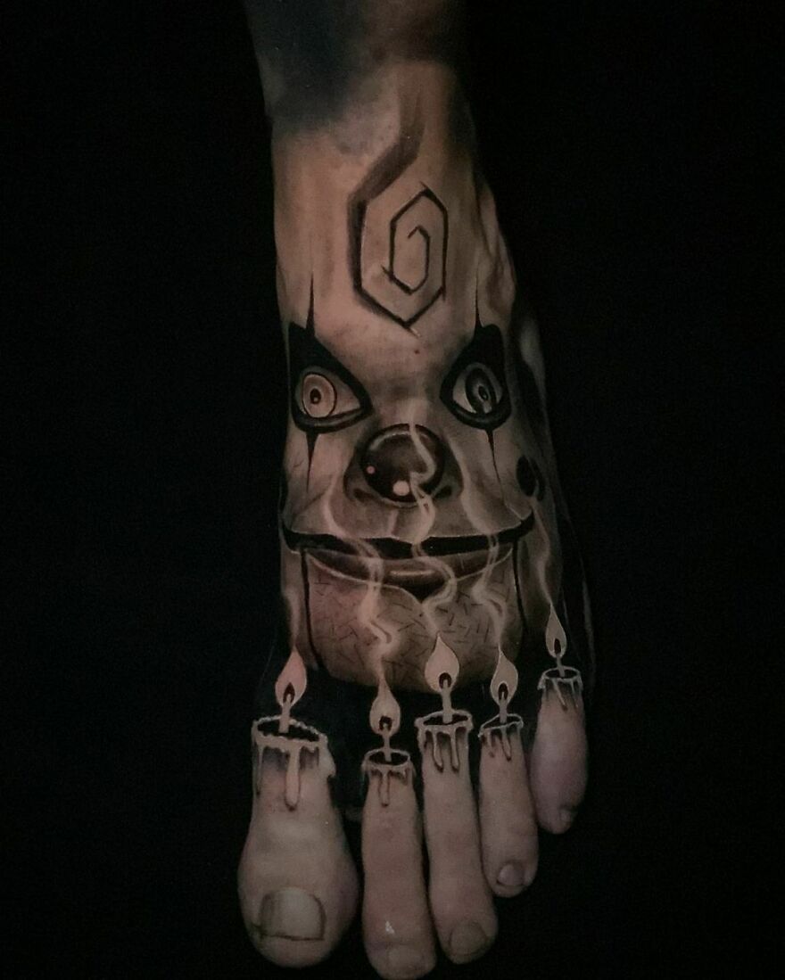 The doll from Dead Silence and fingers like candles tattoo on foot