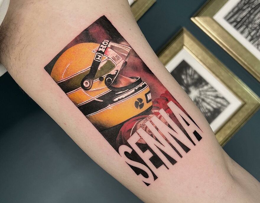 Senna with yellow helmet and letters tattoo