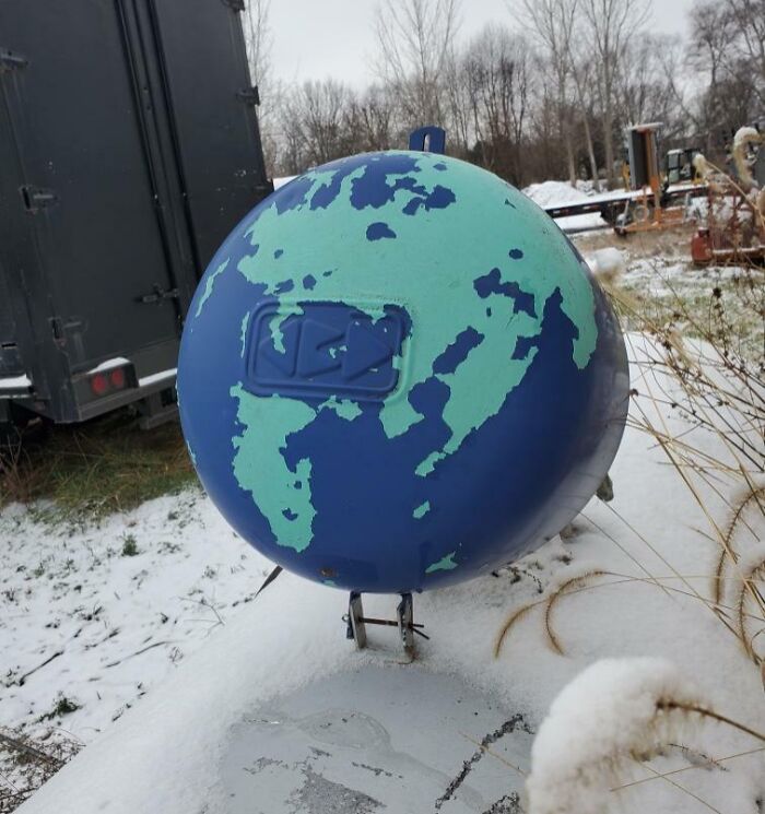Chipped Paint On This Propane Tank Lid Resembles A Globe