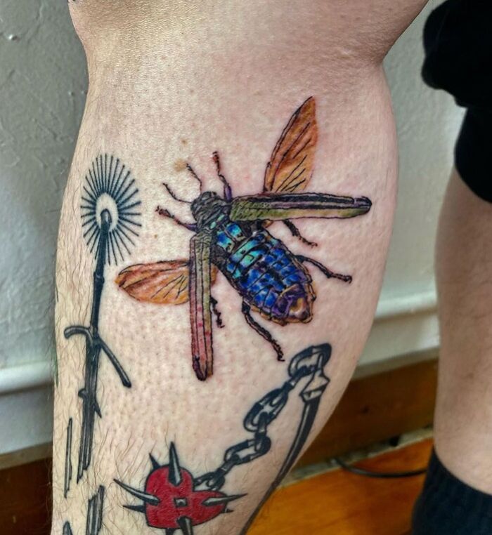 Watercolor fly calf tattoo