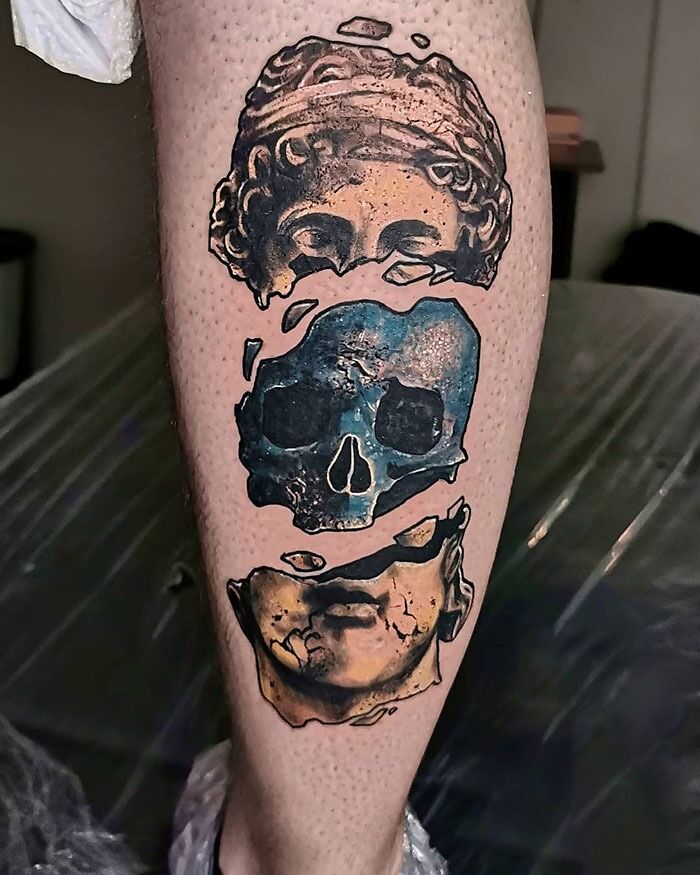 Statue calf tattoo