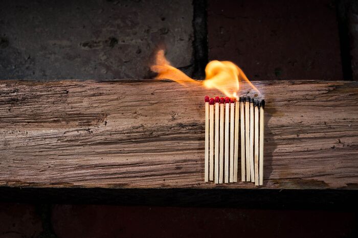 Matches on wood and half of them are on fire