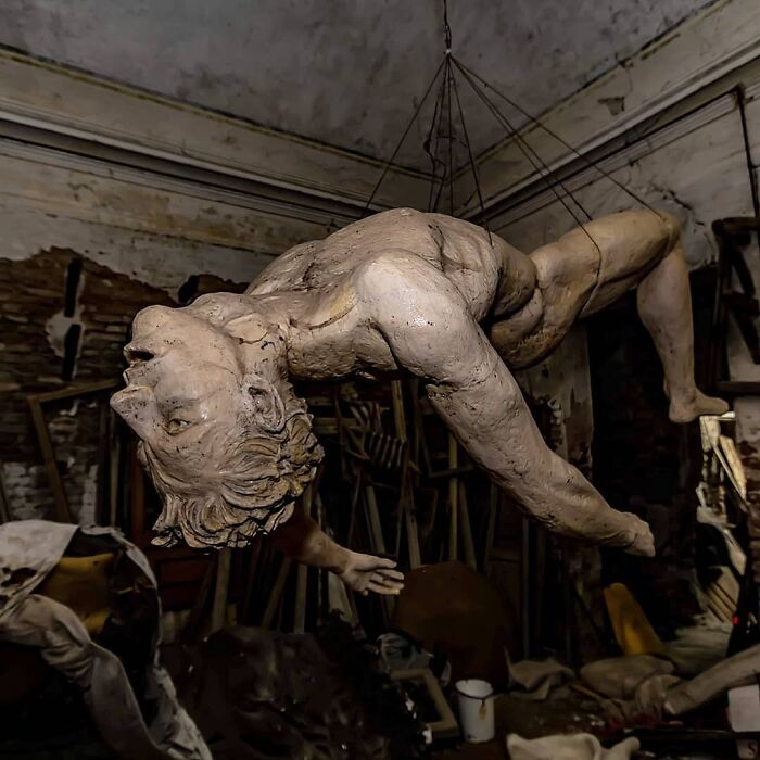 A Statue Hanging In The Cellar Of An Abandoned Castle