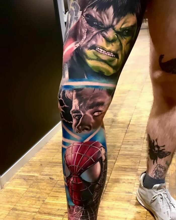 Marvel tattoos featuring Hulk and Spider-Man on a leg, showcasing superhero artistry.