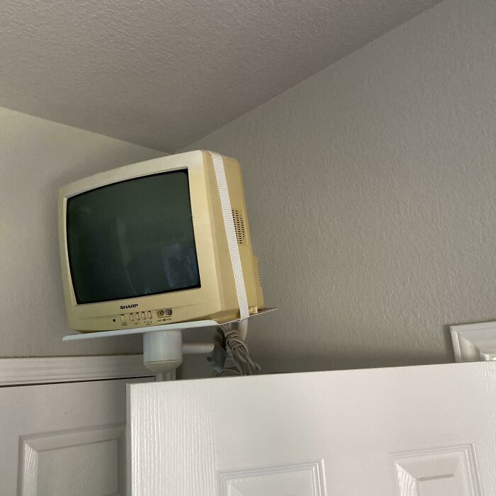 A TV Mounted In The Bathroom Of A House For Sale In My Area (Built In 2004)