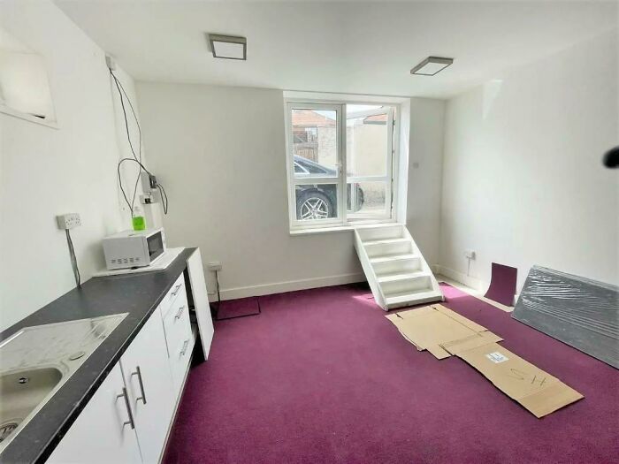 An Apartment In London That Has No Front Door. Just A Set Of Stairs Leading Up To A Window