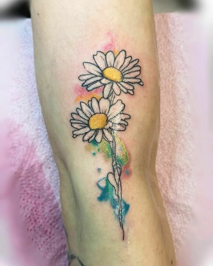 Watercolor daisies hand tattoo