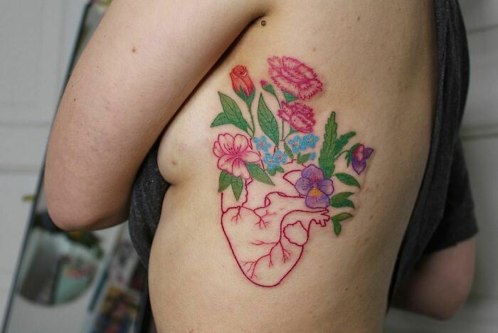 Blooming heart tattoo 